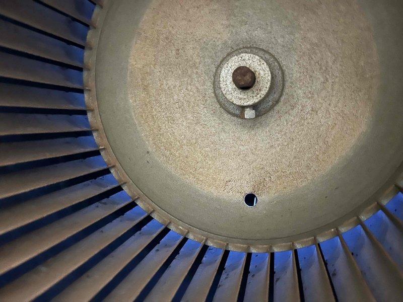 Performed annual preventative maintenance on residential furnace. Inspected blower wheel assembly which showed normal wear with minimal dust accumulation. Recommended replacement of existing air filter to maintain optimal system performance and efficiency.