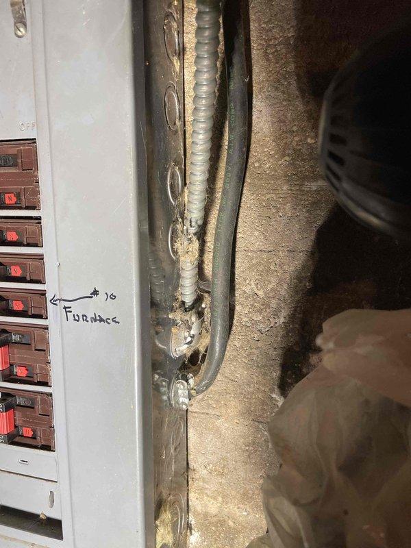 Responded to callback for no hot water on 9-month-old electric water heater. Diagnostic inspection revealed no incoming power to the water heater disconnect. Observed aging electrical components in junction box with visible discoloration and wear. Customer advised of electrical issue and recommended professional electrician for further diagnosis and repair.