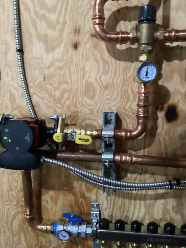 Responded to recall for leaking boiler. Identified improperly seated flange on pump causing water leakage. Corrected flange position and secured connection. System now operational without leaks. Will return to add antifreeze to complete service.