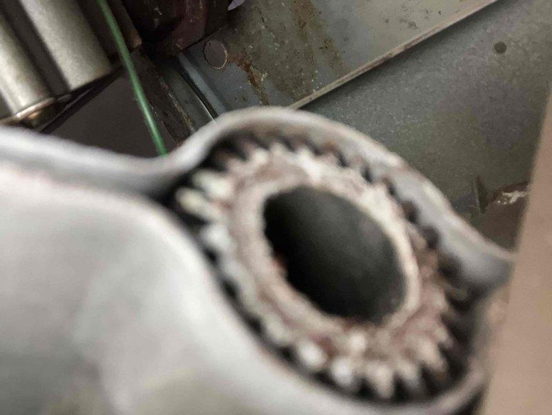 Responded to service call for 29-year-old furnace with exhaust fan squealing. Diagnostic testing revealed combustion readings of 12.4% O2, 17ppm CO, 5.6% CO2, and stack temperature of 244.1°F, indicating inefficient operation. Inspected fan assembly and found worn gear component with visible corrosion. Provided customer with multiple replacement options due to unit's advanced age.