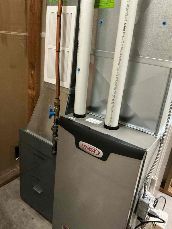 Performed annual preventative maintenance on a 2-year-old Lennox furnace system. Inspected all components including gas connections, PVC intake/exhaust venting, electrical connections, and heat exchanger. System is properly installed with appropriate clearances in basement location and is operating within manufacturer specifications. No issues identified during service.