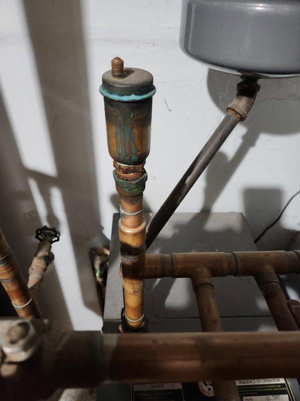 Responded to no heat complaint on 34-year-old Weil McLain boiler. Diagnosed hydro locking issue and sporadic aquastat operation. Observed significant corrosion on valve components and aging expansion tank requiring replacement. Completed necessary repairs to restore heating function.
