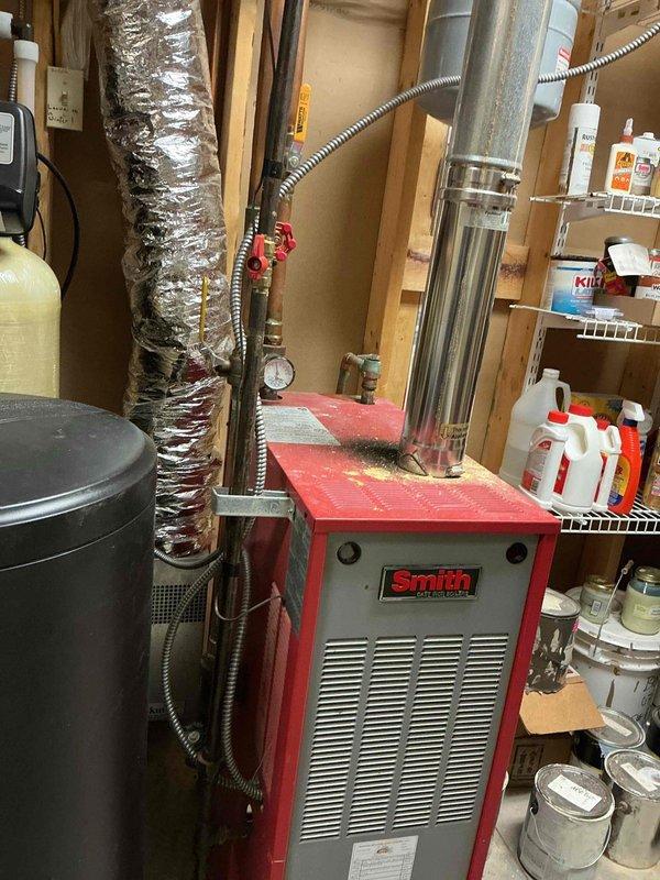 Diagnosed and replaced a failed zone valve in hydronic heating system that was preventing heat distribution to bedroom. Connected and configured electric thermostat to restore proper zone control. System now functioning correctly with proper heat delivery to all zones.
