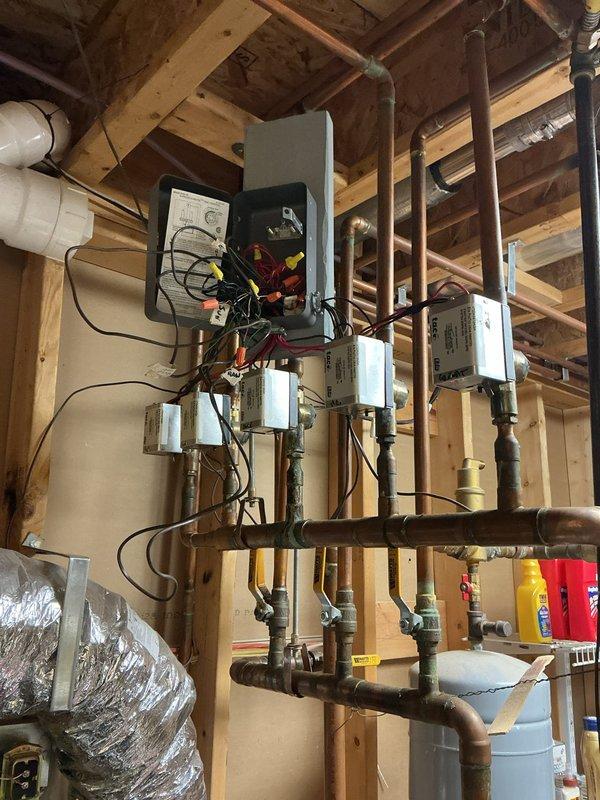 Diagnosed and replaced a failed zone valve in hydronic heating system that was preventing heat distribution to bedroom. Connected and configured electric thermostat to restore proper zone control. System now functioning correctly with proper heat delivery to all zones.
