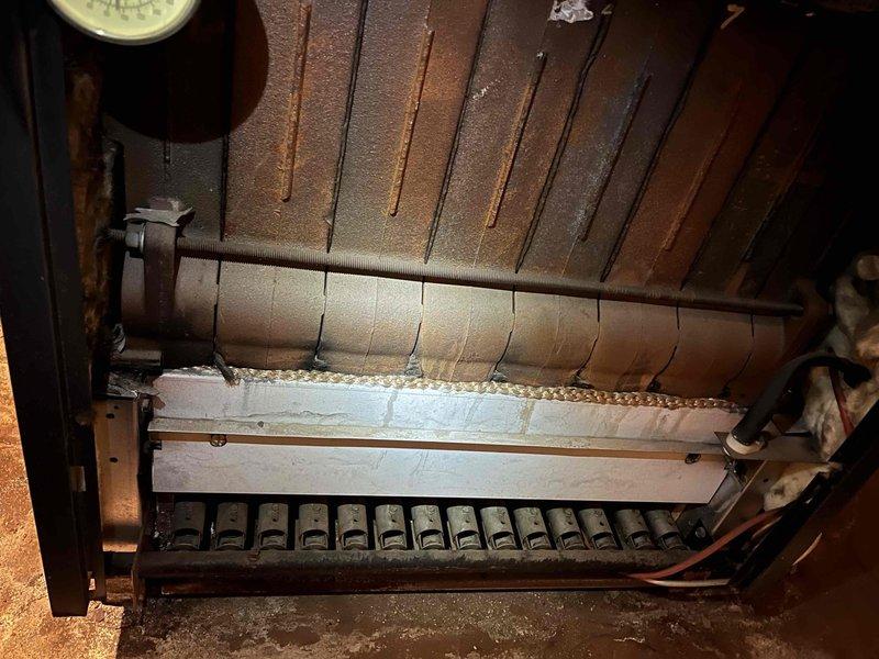 Responded to callback for persistent heating issues in upstairs apartment related to previous service. Diagnosed system failure due to malfunctioning pump and clogged air purges both at the boiler and in the upper level apartment. Completed full replacement of circulation pump and installed new air purges to restore proper heating function throughout the building.