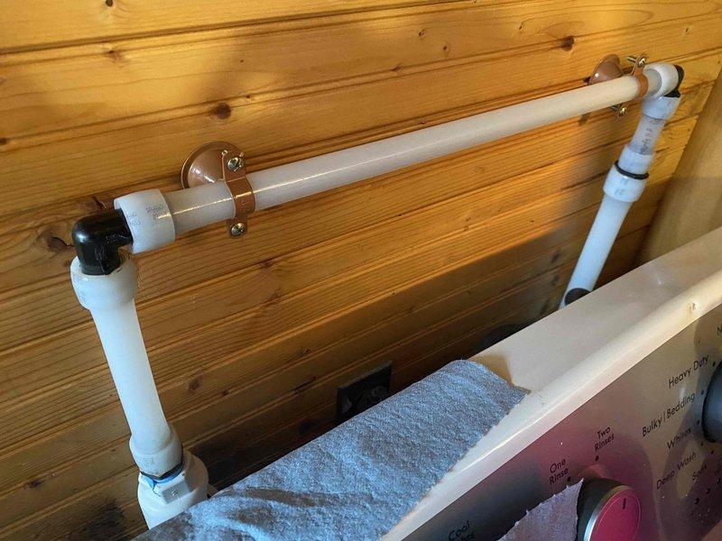 Removed existing water conditioning system and installed new Water Right IMPBF-1054AN acid neutralizer with calcite to address acidic water issues, along with Water Right ASP1-1354 sanitizer with min-plus for iron, hardness and odor treatment. Completed necessary repiping of water lines in closet using PEX material, ensuring proper connection to both treatment units mounted on wooden wall.