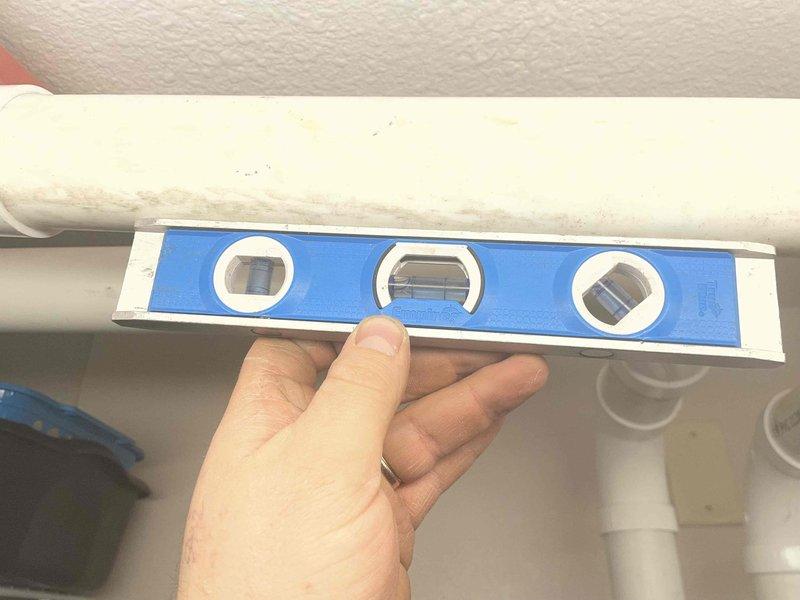 Responded to no heat call for previously installed combi boiler displaying code 09P. Diagnostic inspection revealed improper pitch of exhaust venting from original installation. Corrected exhaust venting slope under warranty to restore proper operation and resolved the no-heat condition.