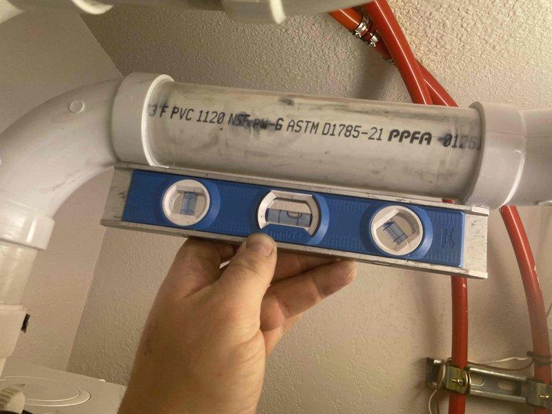 Responded to no heat call for previously installed combi boiler displaying code 09P. Diagnostic inspection revealed improper pitch of exhaust venting from original installation. Corrected exhaust venting slope under warranty to restore proper operation and resolved the no-heat condition.