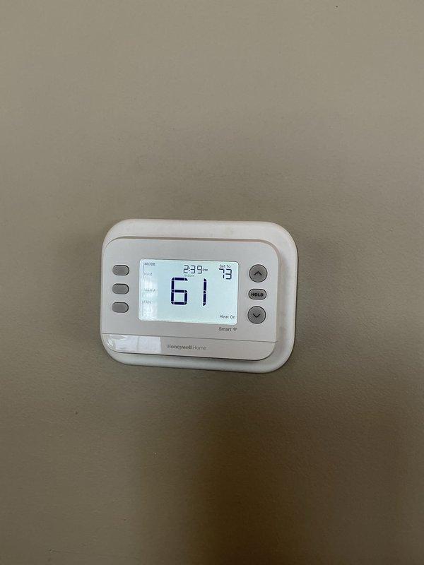 Responded to service callback for non-functioning basement thermostat after previous service. Inspected both the analog circular thermostat and digital Honeywell thermostat in the home. Identified zone board communication issue causing basement thermostat failure. Rescheduled appointment with technician specialized in zone board systems for proper diagnosis and repair.