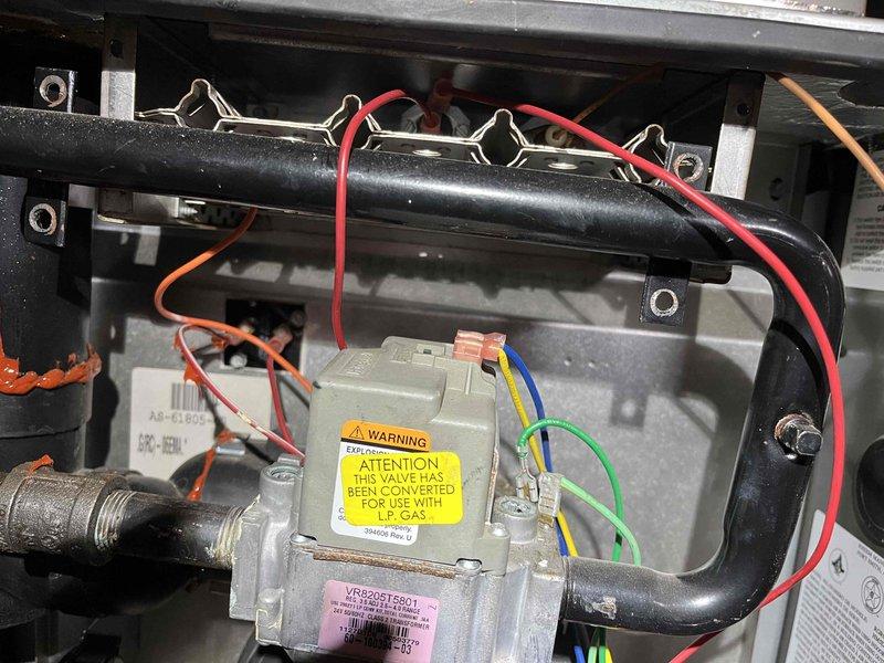 Performed annual furnace inspection on aging unit. Diagnostic testing revealed inducer motor drawing excessive amperage. Observed significant corrosion on burner assembly and confirmed LP gas conversion valve. Recommended inducer motor replacement due to impending failure risk.