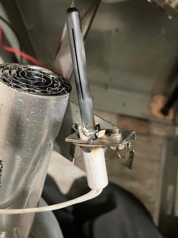 Diagnosed Nortek Global furnace model MG1E056F1ABMW2 with no heat condition. Inspection revealed severely damaged control board with burn marks and a failed ceramic igniter that had exploded. Replaced both the igniter assembly and control board to restore proper heating function.