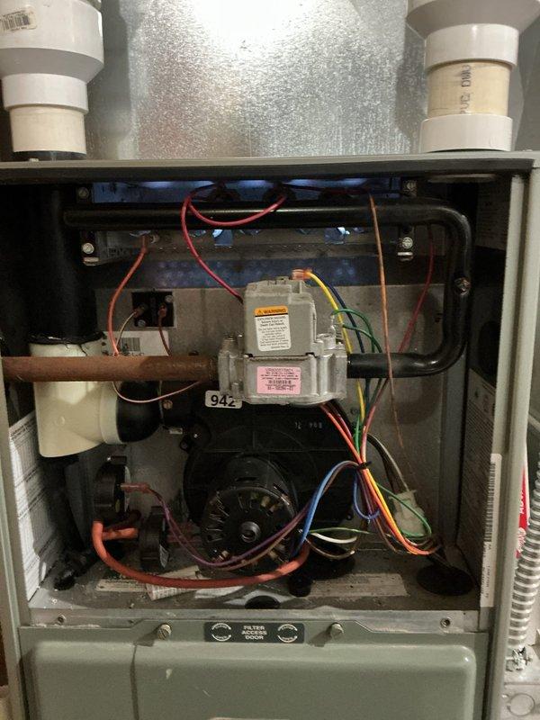 Diagnosed and resolved heating issue on 15-year-old Rheem furnace that was shutting down after reaching 65 degrees. Inspection of internal components revealed a failed pressure switch, which was replaced to restore proper system operation and heat function.