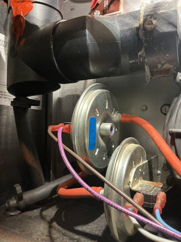 Responded to emergency no-heat call for Rheem furnace that failed to ignite after propane tank depletion. Inspected pressure switches and ignition system, finding that air proving switch was not closing due to debris in the sensing tube. Cleaned pressure switch sensing lines, verified proper operation of ignition sequence, and confirmed system operation through multiple heating cycles.