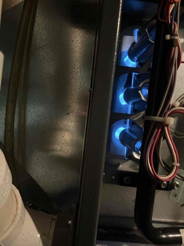 Completed replacement of three burner tubes (10735102S) and flame sensor (0130F00010S) in heating system per maintenance service agreement. Removed burner bar assembly to access components and installed OEM replacement parts. Post-installation testing confirmed proper ignition sequence and flame detection with all three burners showing correct blue flame pattern.