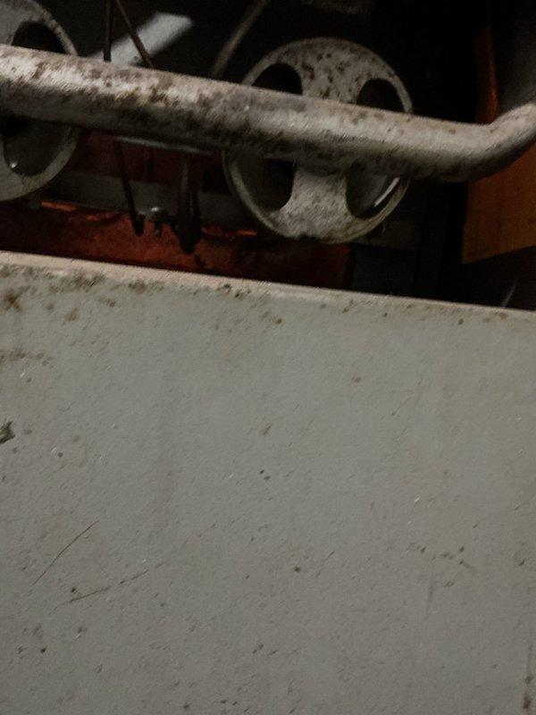 Responded to no heat complaint for residence with Coleman furnace showing significant age. Diagnosed faulty thermostat as source of heating failure. Ambient temperature at arrival was 49.1°F. Replaced thermostat and verified proper system operation, restoring heat to home.