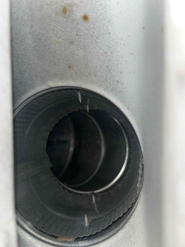 Completed Level 3 duct cleaning service as per customer agreement. Removed accumulated debris and contaminants from ductwork system, addressing visible corrosion and mineral deposits in metal ducts. Service included cleaning of connection points and circular port areas where significant buildup was observed.