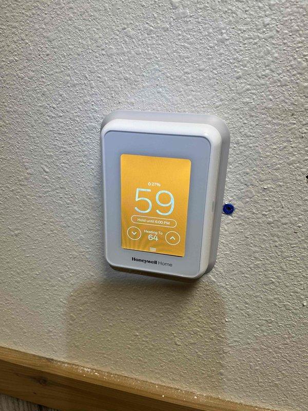 Installed customer-supplied Honeywell T9 Wi-Fi thermostat in upper garage/boat house, replacing existing unit. Installed C-wire adapter and completed necessary wiring to older furnace system after conducting required technical research. All connections were properly terminated and system functionality verified.