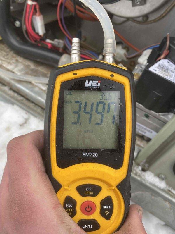 Diagnosed faulty gas valve causing no heat condition on unit under 10 years old. Performed comprehensive testing with EM720 manometer confirming 349 reading outside acceptable parameters. Successfully replaced gas valve and verified proper system operation with all electrical connections to blower motor assembly restored to manufacturer specifications.