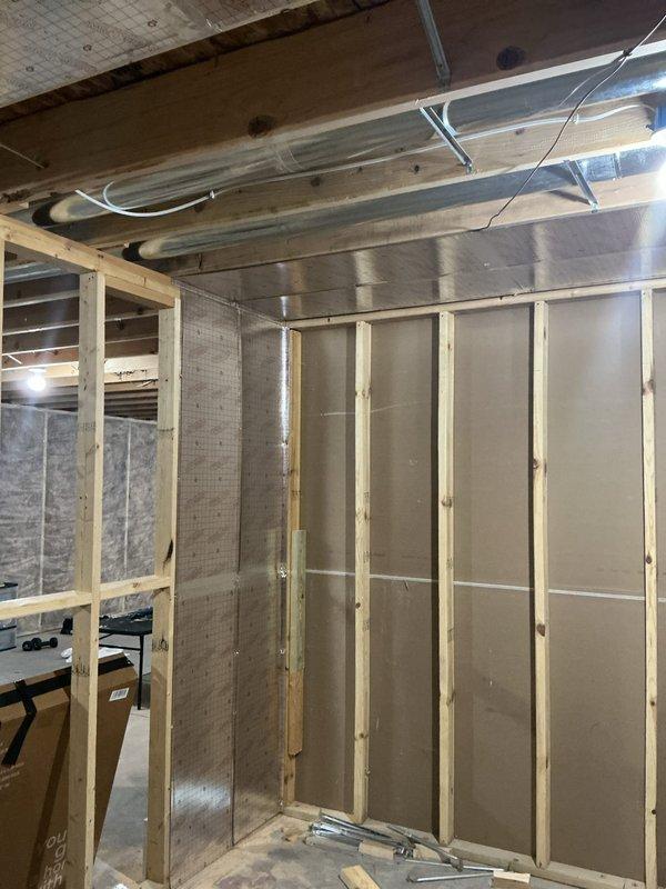 Completed installation of four supply registers in basement with required ductwork modifications, including upsizing 8' of ductwork from 8x14 to 8x16 to accommodate additional airflow requirements. Added large air return and installed right angle filter cabinet per approved estimate. Work included proper framing integration in unfinished basement area and connection to existing HVAC system with all necessary components properly mounted and insulated. Permit was obtained for the installation.