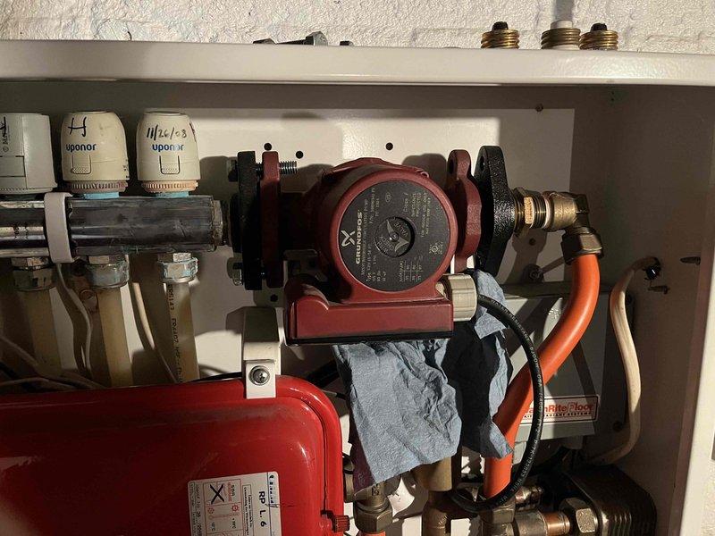 Responded to no heat call for infloor heating system. Diagnosed failed circulation pump that had run dry and burned out. Upper manifold was completely air-bound. Replaced defective pump (part #59896341CI) and added water to system using customer-supplied hose. System could not be pressurized to proper operating level. Additional antifreeze required for system.