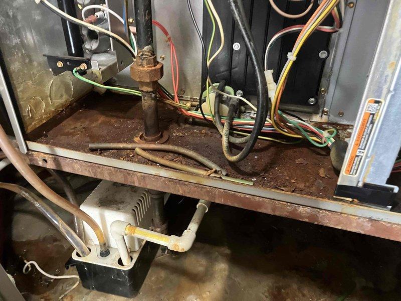Diagnosed Carrier furnace no-heat condition and identified a faulty gas valve with significant corrosion. Replaced gas valve to restore proper heating function. Visual inspection revealed additional rust and debris accumulation throughout system components.