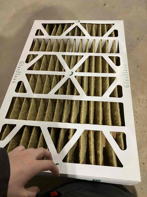 Responded to no-heat call for 5-year-old Heil natural gas furnace. Diagnosed issue as restricted airflow due to heavily soiled air filter. Performed combustion analysis with readings of O2 9.4%, CO 17ppm, CO2 6.6%, and stack temperature 98.7°F. Replaced dirty filter, restored proper airflow, and verified system operation.