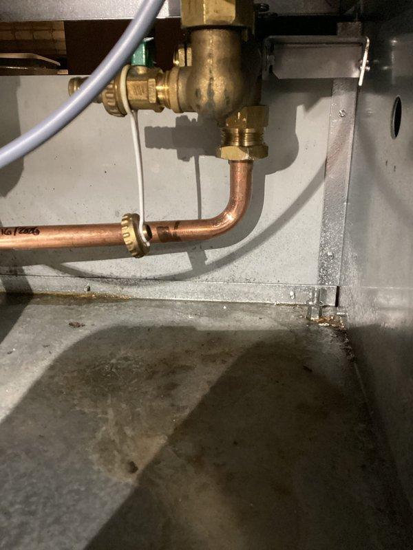 Replaced central heating return pipe in boiler system that had developed a pinhole leak obscured by corrosion. Installed new copper piping with brass fittings and verified proper connection to the existing system. All work completed successfully with no issues.