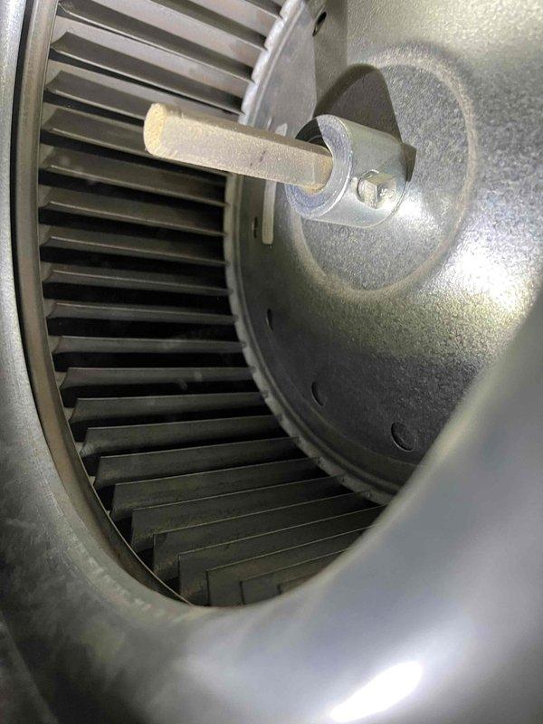 Performed annual maintenance on 10+ year old furnace located in garage closet. Inspection revealed residue in burners, low capacitor reading, buzzing inducer motor, and water leak in exhaust piping. Provided customer with repair options after documenting issues with blower wheel assembly and other components.