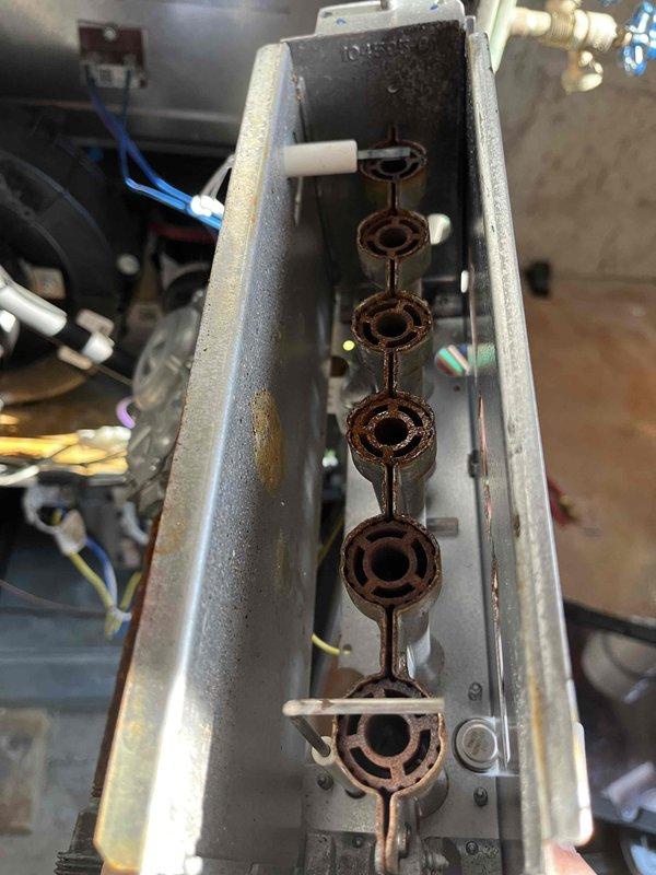 Completed annual tune-up on basement Lennox furnace. Identified multiple issues including burner corrosion, low capacitor performance, high resistance in flame sensor, and igniter residue. Presented repair options to address these concerns.