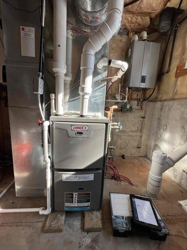 Completed annual tune-up on basement Lennox furnace. Identified multiple issues including burner corrosion, low capacitor performance, high resistance in flame sensor, and igniter residue. Presented repair options to address these concerns.