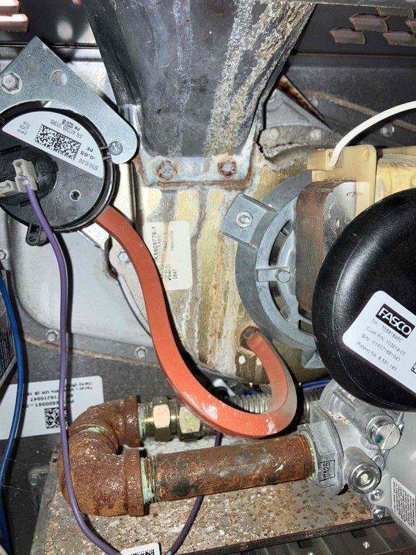 Performed annual preventive maintenance on existing furnace system. Identified significant corrosion on copper piping and moisture issues causing rust formation on multiple components. Documented extensive water damage and component wear with photos for future reference; customer was provided with separate estimate for recommended furnace replacement.