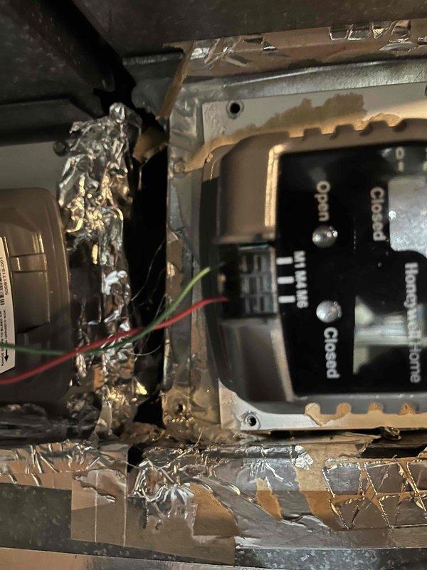 Completed warranty service to replace malfunctioning Zone 2 damper and installed vibration reduction pad under transformer to address noise issues. Documented existing wiring configuration and control panel connections before performing replacement. System functioning properly after repairs.