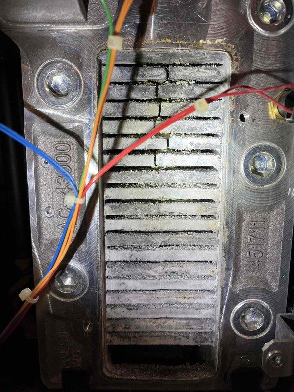 Performed prepaid partner plan inspection on boiler system. Found corrosion on electrode and significant buildup on heat exchanger, particularly affecting ventilation components. Documented issues with photos and provided customer with repair estimates for necessary service work.