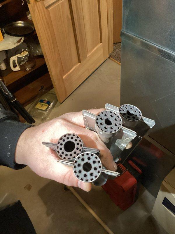 Completed annual preventative maintenance service on gas furnace under prepaid maintenance agreement. Removed and cleaned burner assembly and flame sensor to address corrosion buildup. Inspected blower wheel and electrical connections, documenting condition with photos for service records.