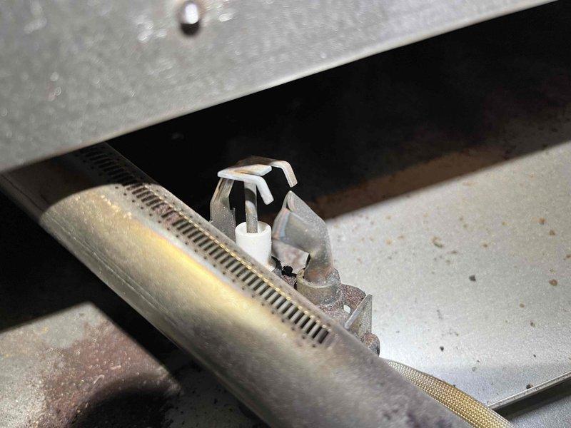 Completed annual prepaid maintenance on furnace under service plan. Found gas manifold pressure at 3.7"wg, exceeding specifications; adjusted down to 3.5"wg per manufacturer requirements. Removed stripped burner chamber access screw by grinding head, completed inspection, and replaced with new fastener upon completion.