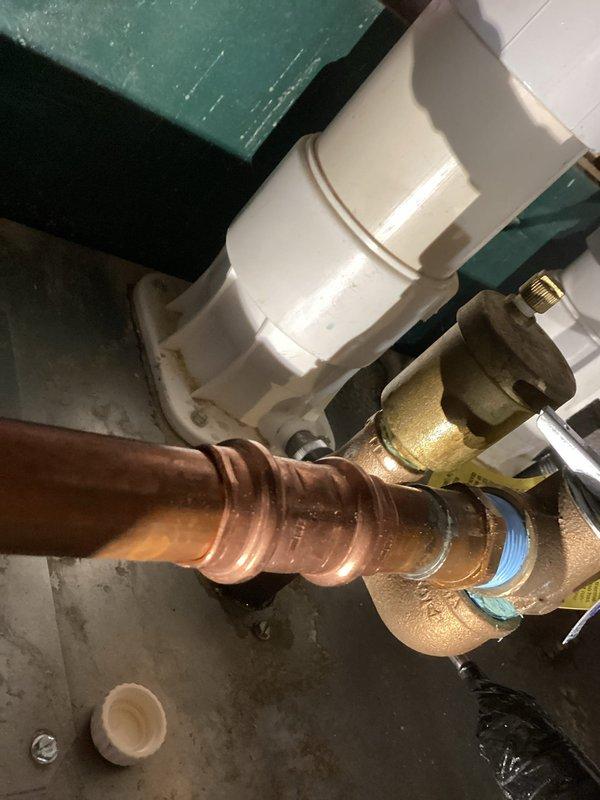 Responded to no-heat call for boiler system. Diagnosed multiple leak points in copper piping causing system pressure loss. Documented evidence of water quality issues affecting the installation; recommended plumber evaluation of water conditioning setup to prevent future leaks.