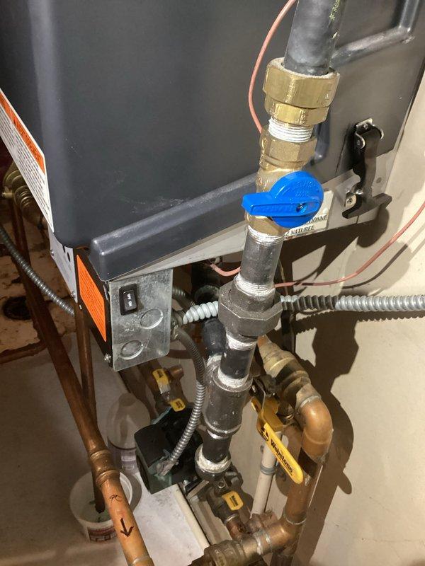 Diagnosed FLU error code on aging boiler system with heat exchanger leaking water and carbon monoxide, confirmed with combustion analyzer readings showing unsafe CO levels. Cleared plugged condensate drain line but determined unit has catastrophic failure requiring replacement due to compromised heat exchanger integrity. Advised customer of safety concerns and replacement options.