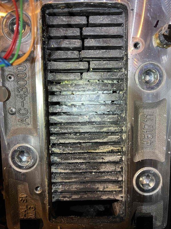 Responded to no heat/hot water callback for recurring issue. Discovered severely sedimented heat exchanger with approximately 90% airflow restriction. Performed thorough cleaning of heat exchanger to restore proper operation and recommended boiler repipe of basement return line to prevent future sediment accumulation.
