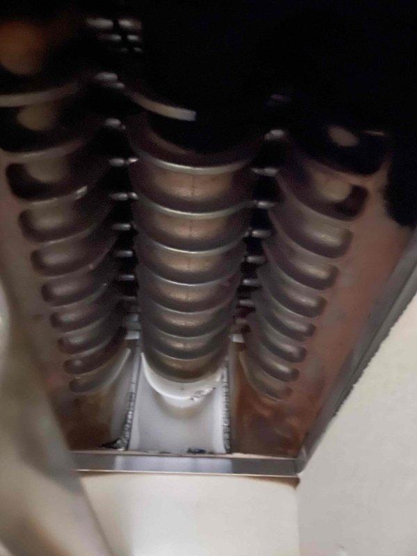 Responded to callback for no heat on recently installed boiler. Discovered pilot assembly was missing the orifice, which was installed during service. Cleaned heat exchanger and verified proper combustion to restore system functionality.