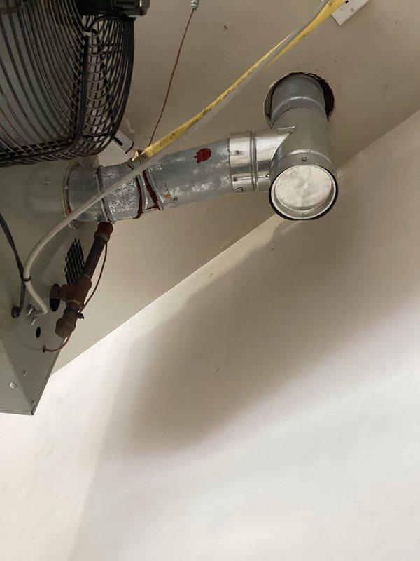 Began replacement of heat exchanger on ceiling-mounted HVAC unit per approved estimate. Inspected ductwork connections and ventilation system, documenting existing conditions with photos. Service was partially completed; technician will return tomorrow to finalize installation and ensure proper functionality of the heating system.