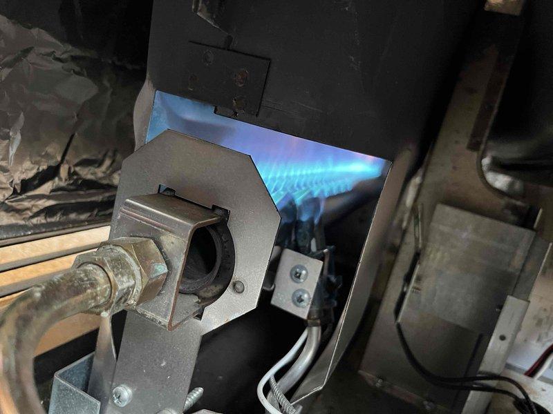 Performed annual inspection on 24-year-old cabin heater (second unit on property). Observed significant corrosion on pilot assembly and burner, with flame pattern indicating proper combustion during testing. Advised customer that while system is operational, replacement of pilot assembly is recommended, though burner component is obsolete.