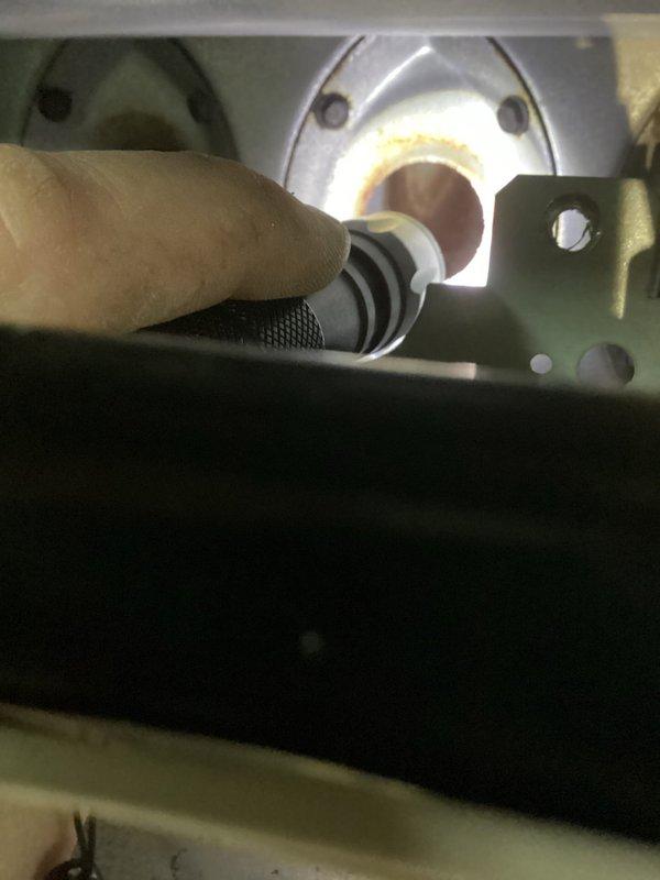 Performed annual maintenance on furnace including inspection of blower wheel and combustion chamber. Checked ignition system functionality with visual inspection of flame pattern through observation port. Blower assembly appears operational with no significant buildup or damage to fan blades.