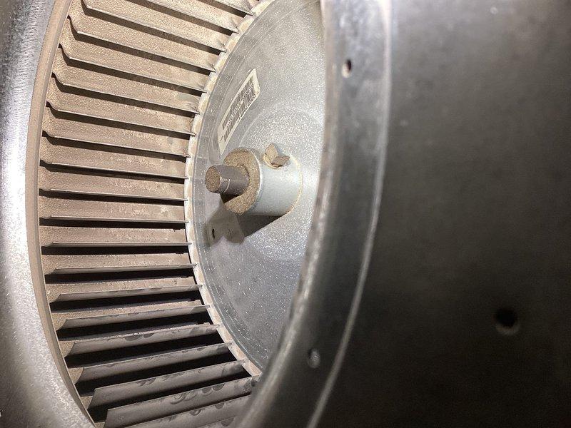 Performed annual maintenance on furnace including inspection of blower wheel and combustion chamber. Checked ignition system functionality with visual inspection of flame pattern through observation port. Blower assembly appears operational with no significant buildup or damage to fan blades.