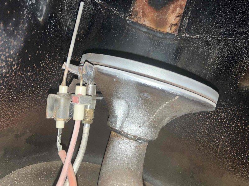 Responded to no heat call for aging natural gas furnace. Diagnosed dead batteries in thermostat and observed significant condensation on heat exchanger components. Upon inspection of the 10+ year old unit, determined furnace requires replacement due to age and condition.