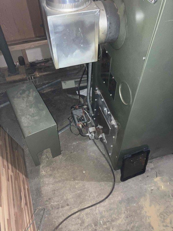 Responded to no heat call for aging natural gas furnace. Diagnosed dead batteries in thermostat and observed significant condensation on heat exchanger components. Upon inspection of the 10+ year old unit, determined furnace requires replacement due to age and condition.