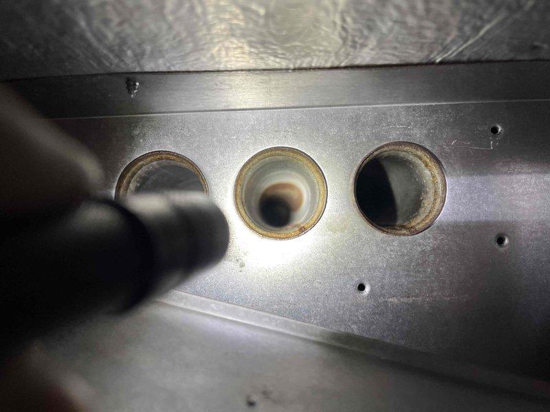 Performed annual inspection on rental property furnace, observing notable corrosion on burner assembly, flame sensor, and igniter. Documented evidence of deterioration with significant rust formation around burner ports and mounting brackets. Completed evaluation of system components and provided customer with estimates for recommended repairs.