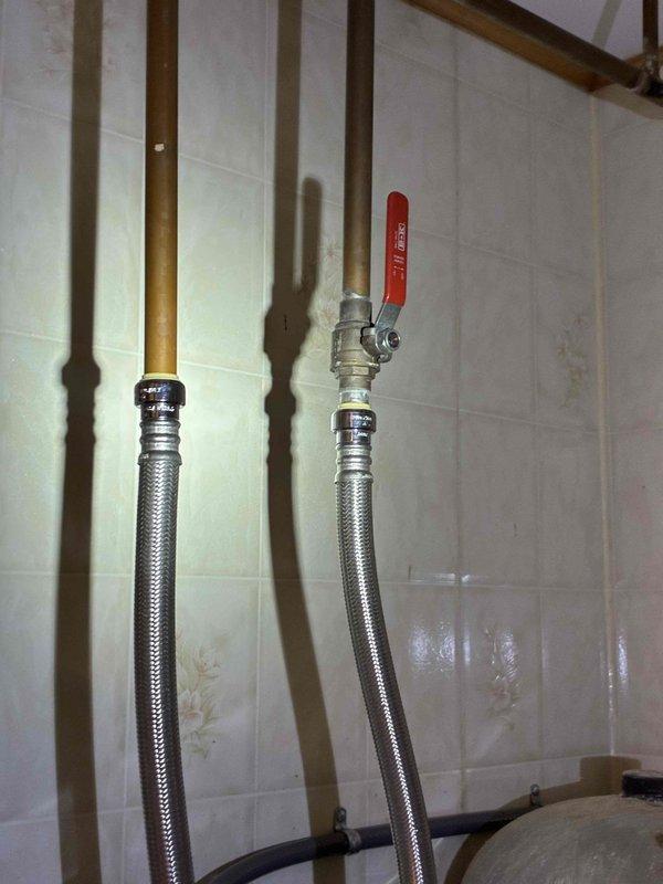 Successfully connected water supply lines to customer-supplied electric water heater, replacing leaking valves with new ones and ensuring proper connection of flexible stainless steel braided hoses. Verified all low point valves in basement were properly closed before restoring water service, and inspected kitchen faucet to confirm no leaks were present.