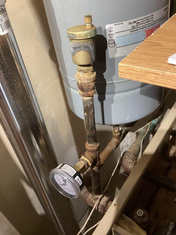 Performed annual inspection on 22-25 year old natural gas boiler. Identified significant corrosion and mineral buildup on plumbing components, particularly around joints and fittings. Presented customer with immediate repair options, preventative maintenance recommendations, and replacement alternatives due to system's advanced age and multiple issues.