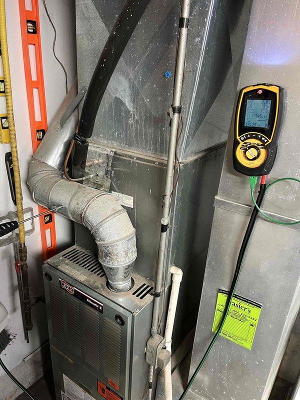 Replaced seized and rusted inducer draft motor on Bryant furnace system. Post-installation testing with digital analyzer confirmed proper combustion parameters and safe operation, with temperature readings at 104.1°F. Restoration of system functionality and safety verified through comprehensive diagnostic assessment.