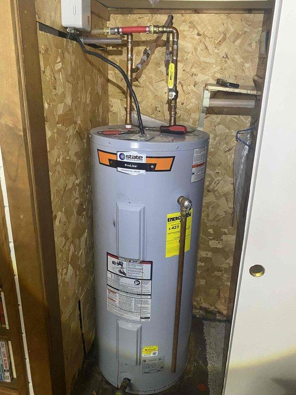 Responded to no hot water service call and discovered leaking electric water heater. Removed failed unit and installed new State brand water heater in utility closet with proper copper pipe connections, including shut-off valves. Verified proper operation of new unit before completing service.